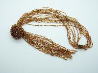 Fab Long Multi Strand Gold and Clear Glass Seed Bead Flower Tassel Necklace